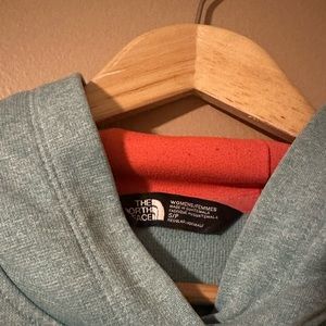 Women’s teal/pink North Face hoodie small